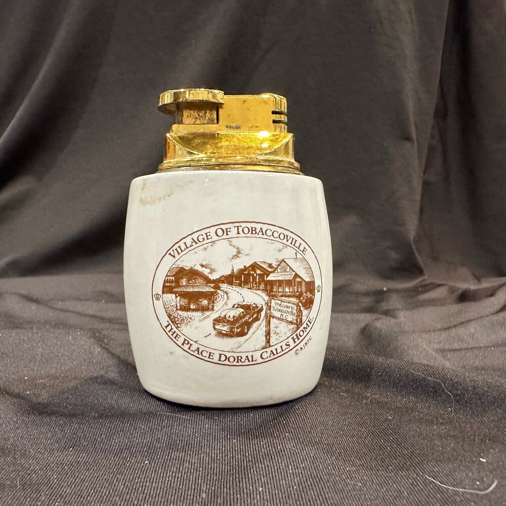 Vtg Doral Refillable Lighter Village of Tobaccoville The Place Doral Calls Home